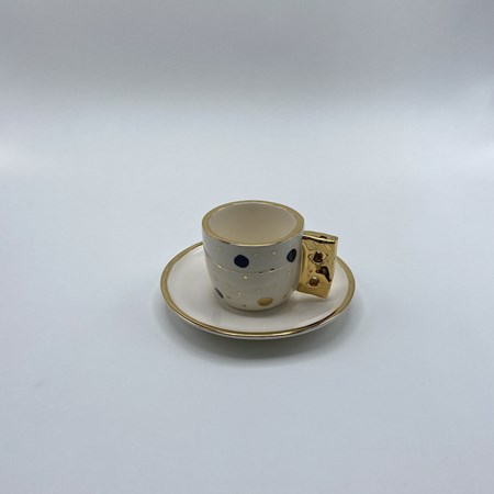 تصویر  فنجان و نعلبکی قهوه‌خوری خال‌خالی مشکی طلایی