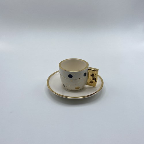 تصویر  فنجان و نعلبکی قهوه‌خوری خال‌خالی مشکی طلایی
